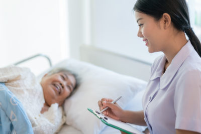 A Wound Care Nurse Taking Care of a Patient