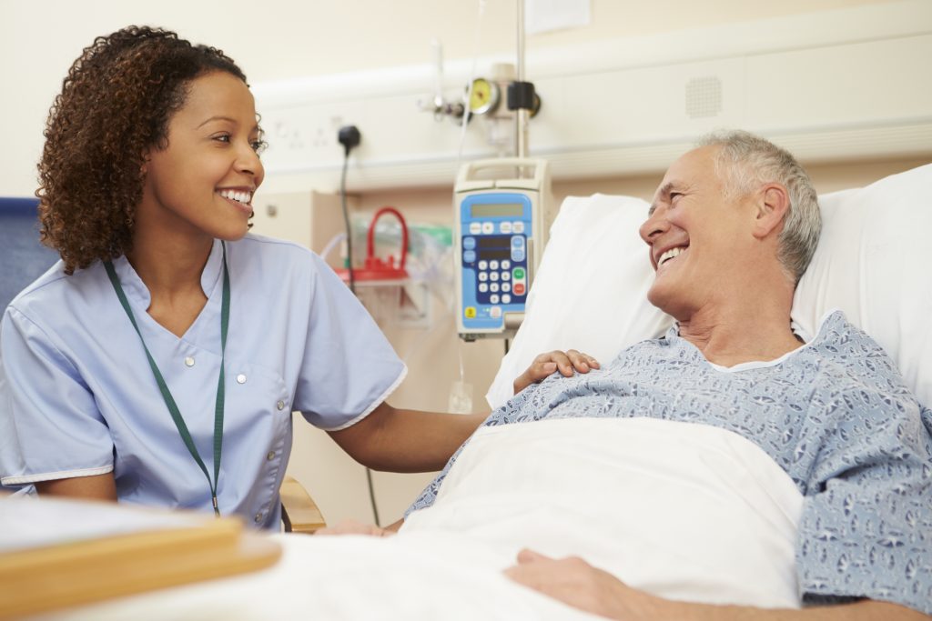 Nurse happily Communicating with patient