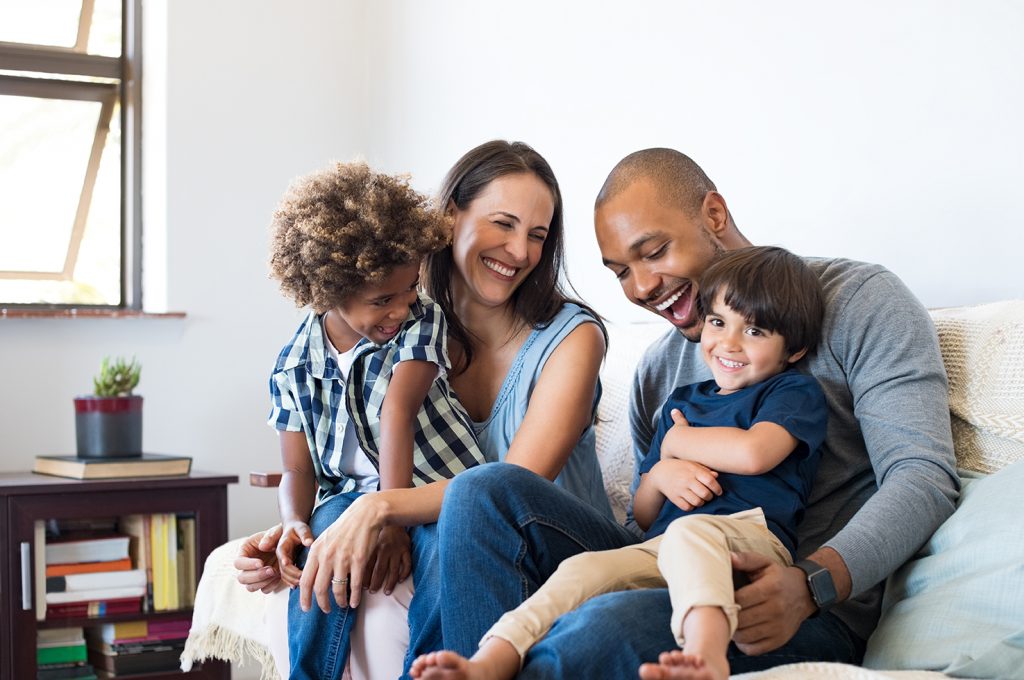 Smiling Parents with their Children